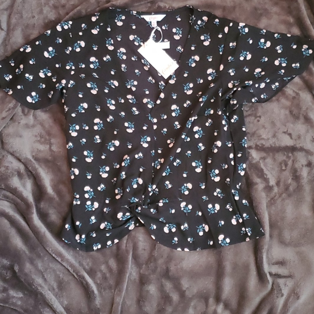 Flowers on a twist front with flutter peplum